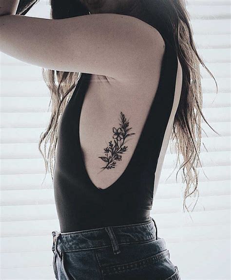 back and rib tattoos|tattoos on ribs for females.